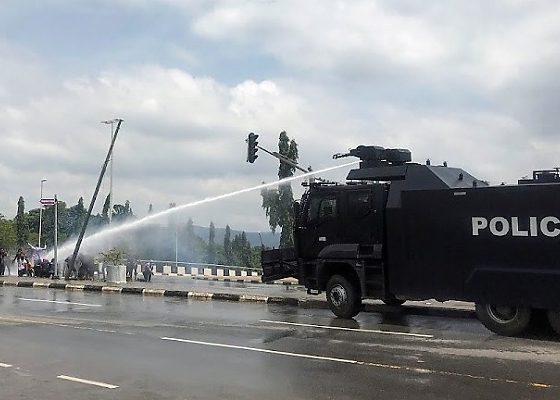 Protest : Moment Police Armored Water Cannon Truck Rammed Into NSCDC Truck, Injuring An Officer - autojosh