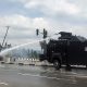 Protest : Moment Police Armored Water Cannon Truck Rammed Into NSCDC Truck, Injuring An Officer - autojosh