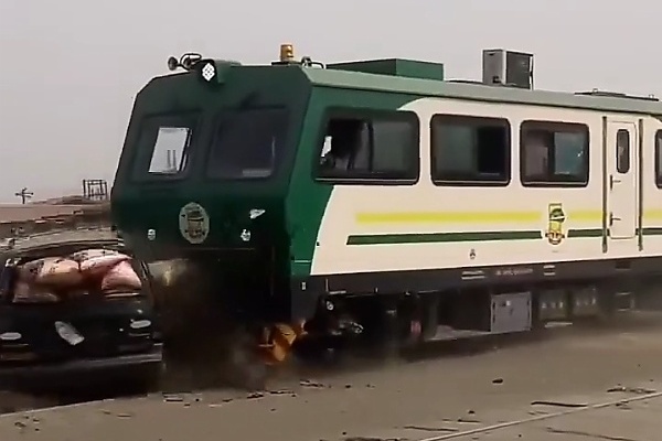 Moment A Moving Train Crashed Into Stuck Rice-Laden Toyota Sienna In Lagos - autojosh