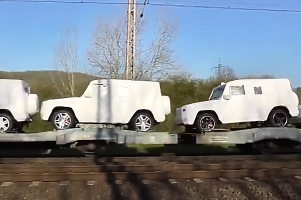 Watch As Dozens Of Mercedes G-Class SUVs In White Protective Covers Get Transported By Train - autojosh 