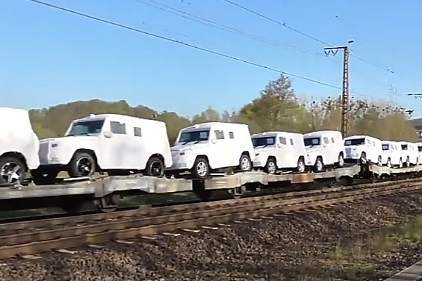 Watch As Dozens Of Mercedes G-Class SUVs In White Protective Covers Get Transported By Train - autojosh 