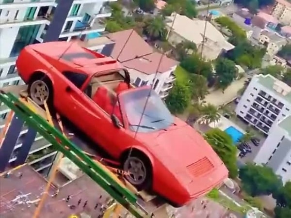 Burna Boy Lifts ₦1.6B Ferrari Testarossa Into His 26th Floor Penthouse - autojosh