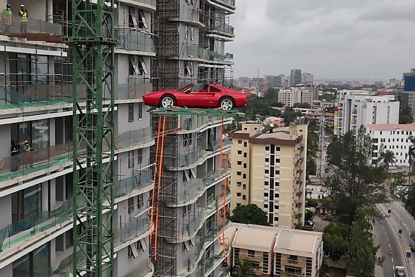Burna Boy Lifts ₦1.6B Ferrari Testarossa Into His 26th Floor Penthouse - autojosh