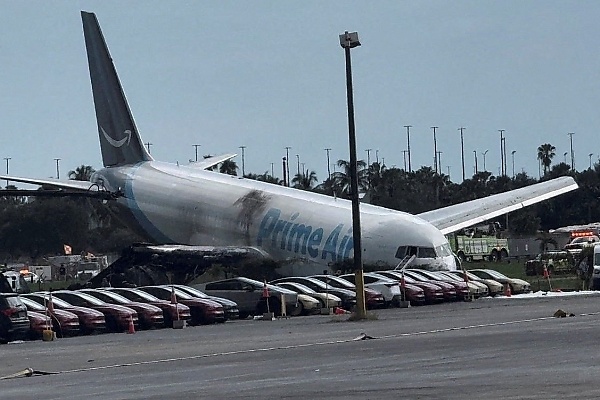 Amazon Cargo Plane Crashes In Miami, Narrowly Misses Car Lot Full Of Tesla Cybercabs - autojosh 