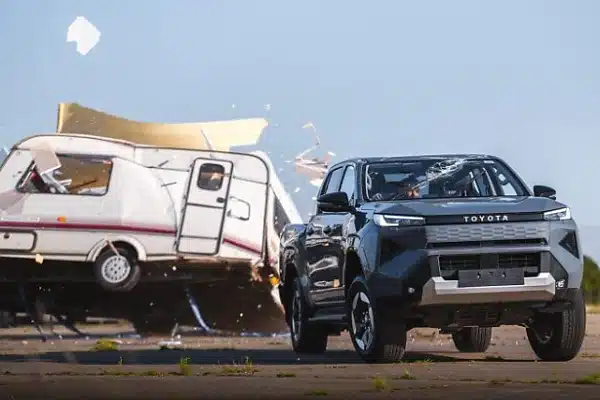 Toyota Drops 760kg Caravan on All-Electric Hilux To Prove It Remains ‘Indestructible’