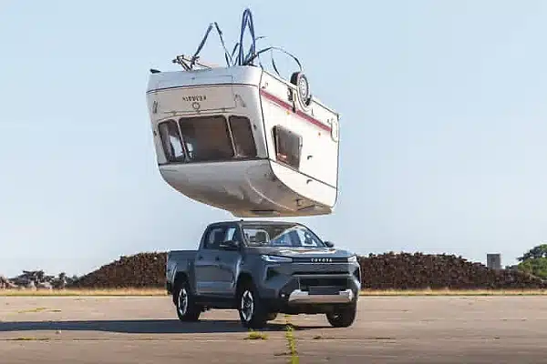 Toyota Drops 760kg Caravan on All-Electric Hilux To Prove It Remains ‘Indestructible’