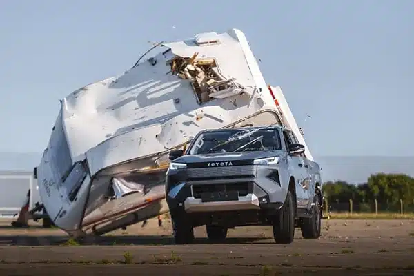Toyota Drops 760kg Caravan on All-Electric Hilux To Prove It Remains ‘Indestructible’